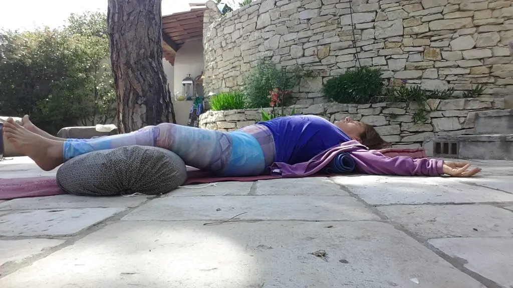 32714404 1957490607594980 2234993258763649024 o yoga nidra woman in blue on the floor tradition savasana